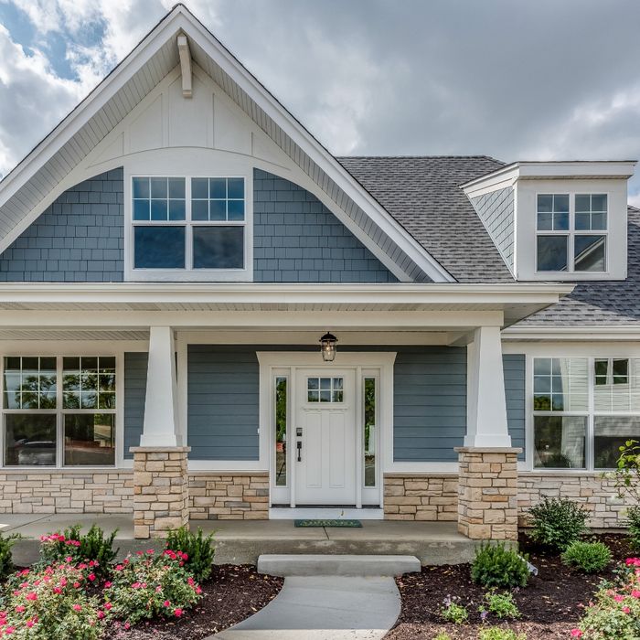 image of a house with natural stone border