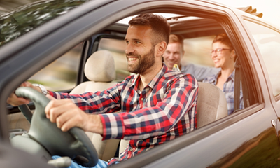 Guy driving with his friends