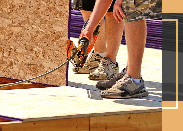 man installing subfloor