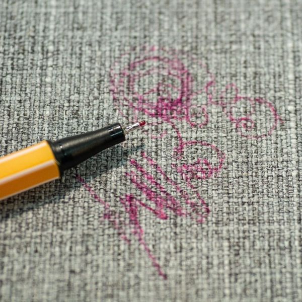 pink pen stains on couch upholstery