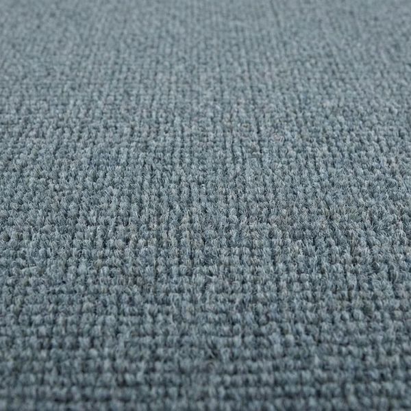 the texture of clean grey-blue commercial office carpet