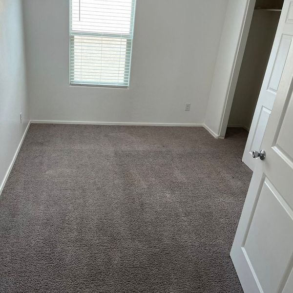 small carpeted room, freshly cleaned