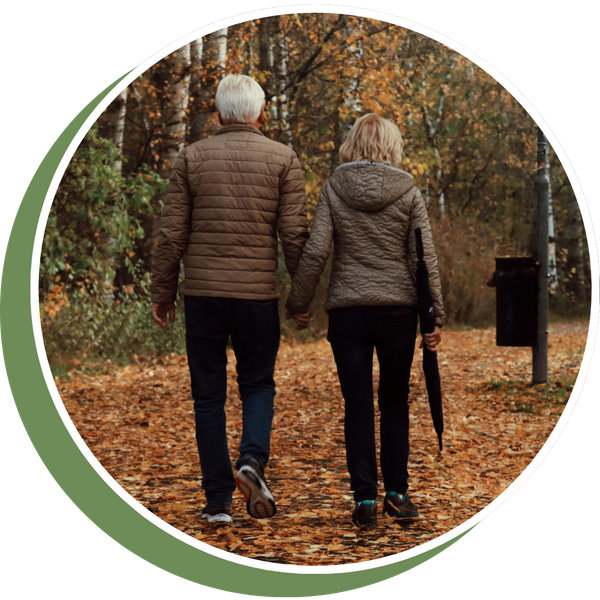 older couple walking away outside