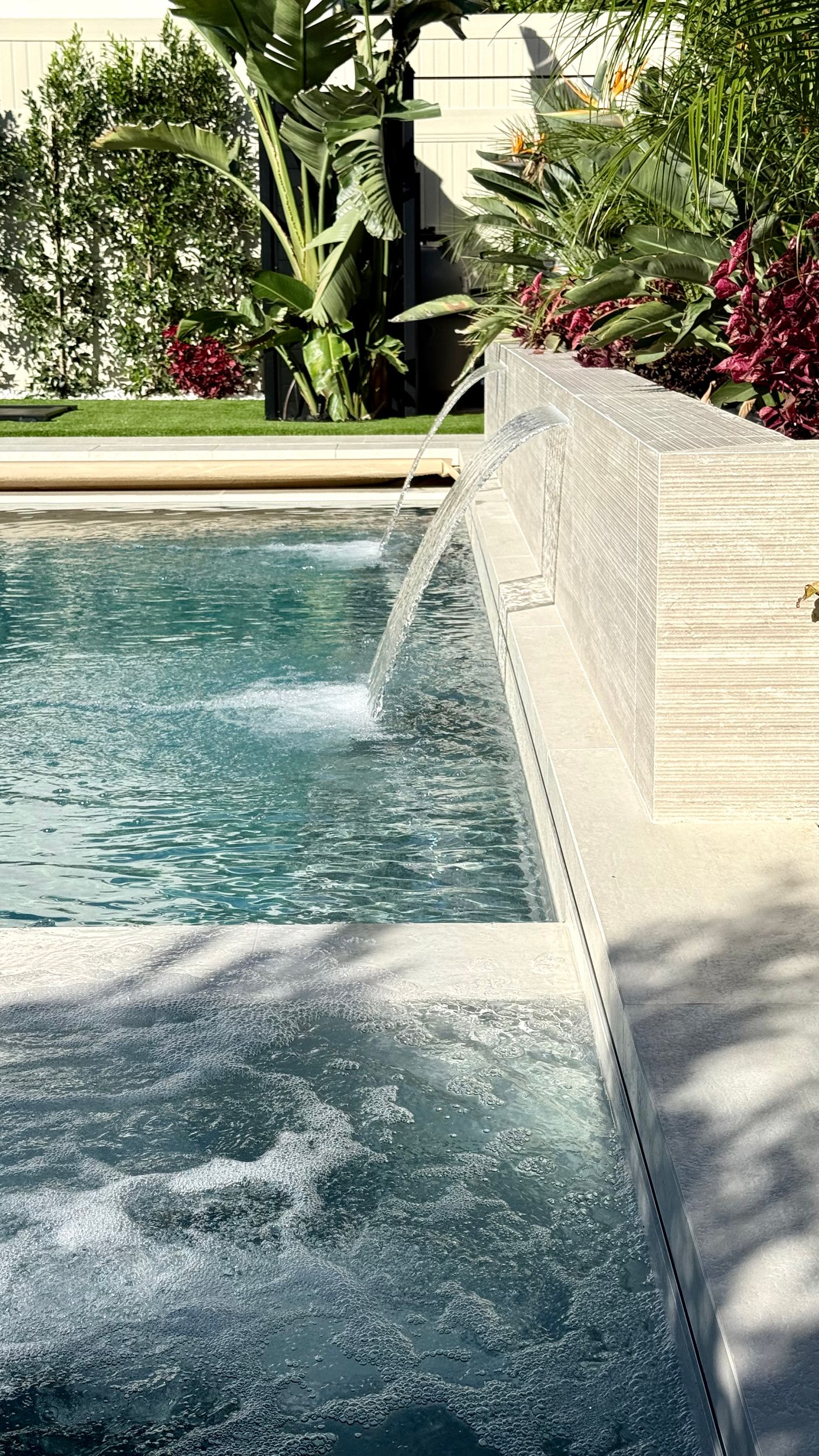 descent water feature on raised wall in a modern Woodland Hills