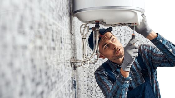 plumber installing a water heater 