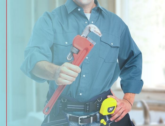 plumber holding a tool