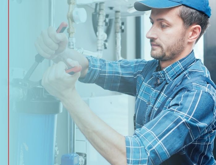 plumber installing water filtration 