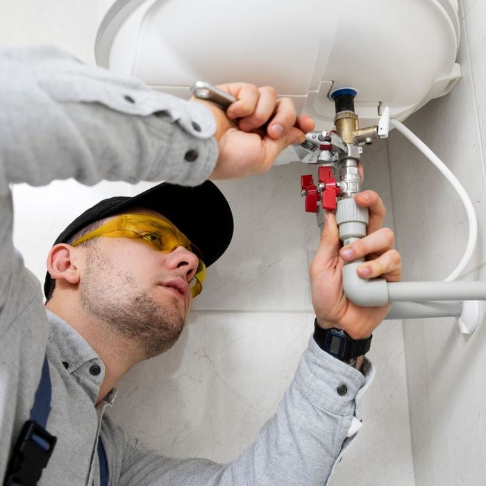plumber fixing a sink