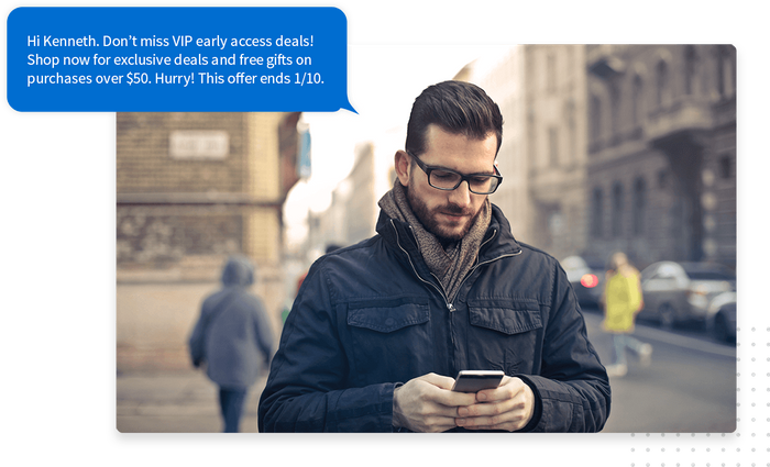 Man reading a text message on his smartphone overlaid with marketing text with a curated offer Text message marketing exclusive offer
