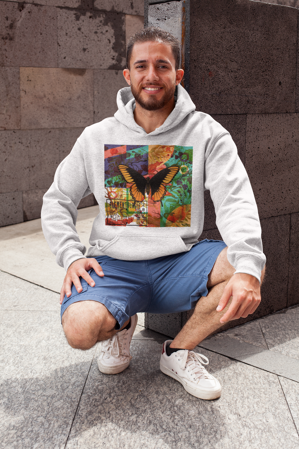 heathered-hoodie-pullover-mockup-featuring-a-smiling-man-in-a-crouching-position-28629.png