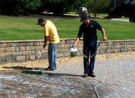 spraying paver sealer