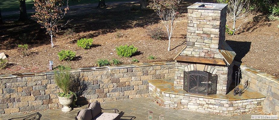 retaining wall and fire pit made from paver bricks