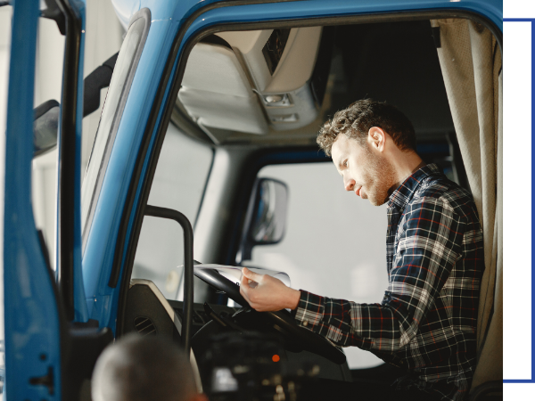 truck driver looking at paperwork