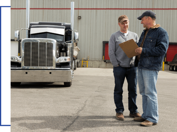 man holding clipboard by truck