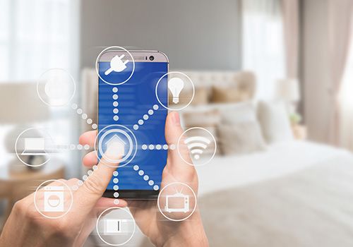 Person using smart phone to control their smart home