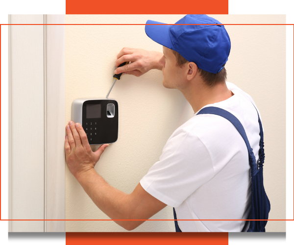 Professional installing a security system. 