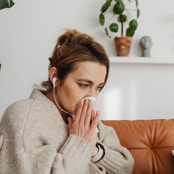 woman blowing her nose