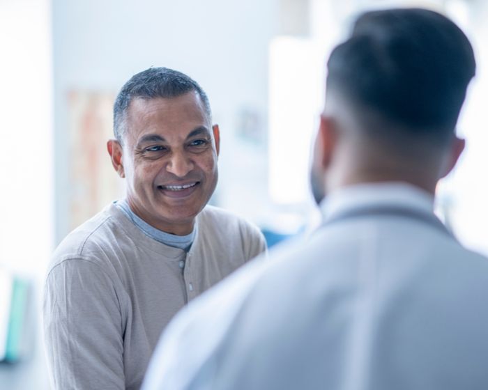 A patient speaking with their doctor