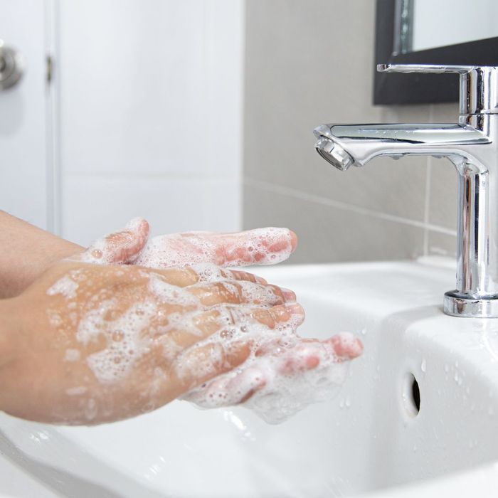 person washing hands