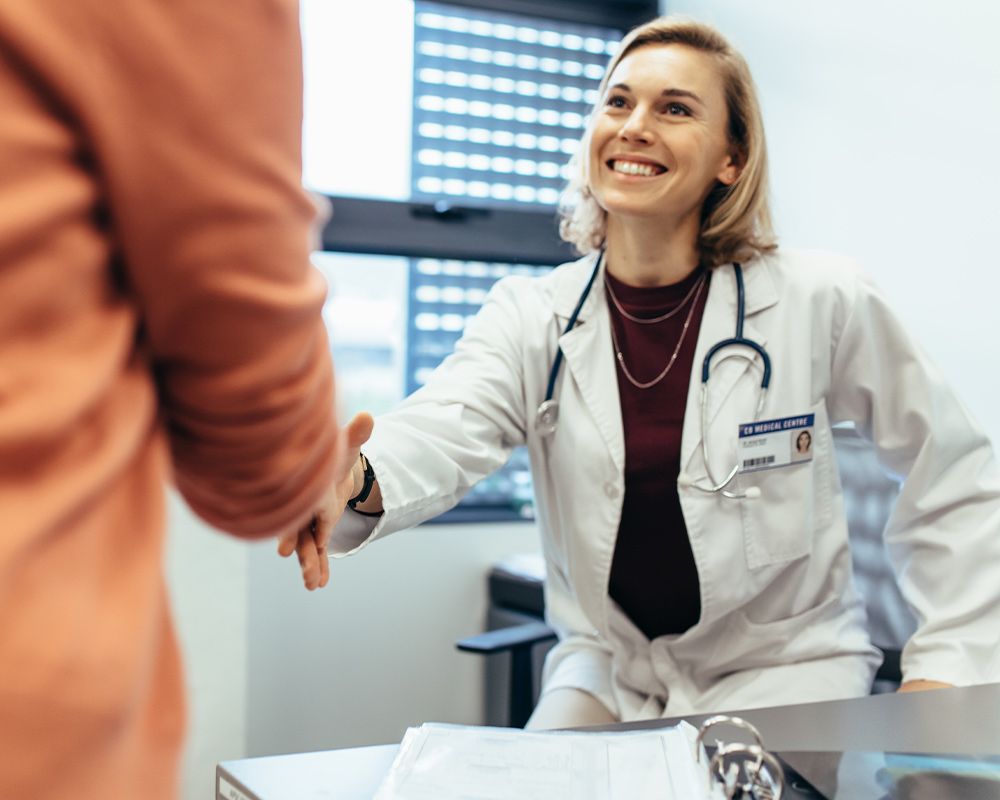 a doctor shaking a patients hand