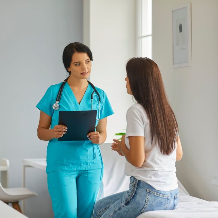 nurse and patient speaking