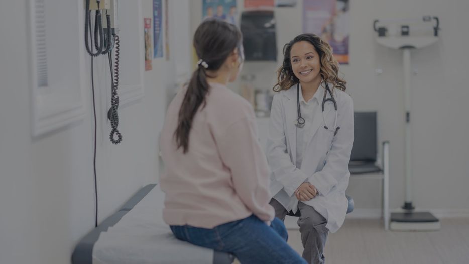 woman talking with doctor