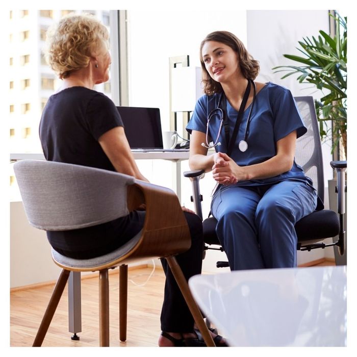 woman talking with doctor