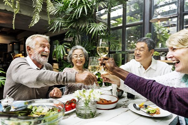 People toasting at a restaurant table