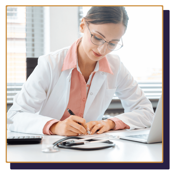 doctor taking notes, looking over finances doctor taking notes, looking over finances