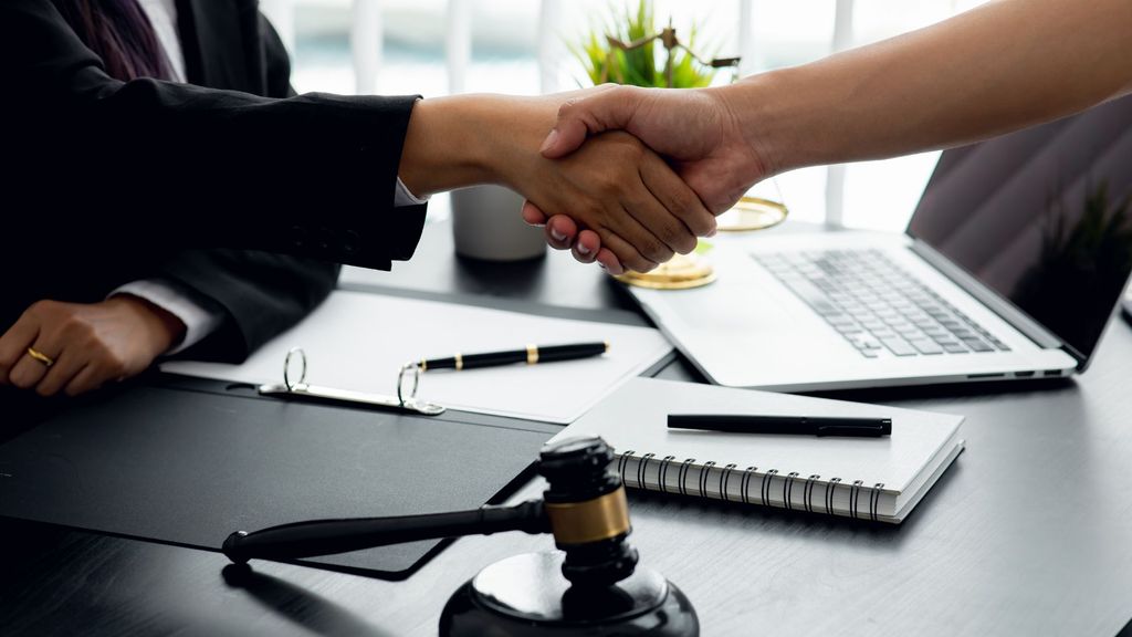 Lawyer and client shaking hands