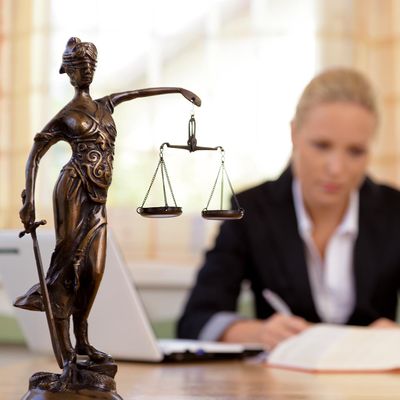 Figurine of Lady Justice on a lawyer's desk