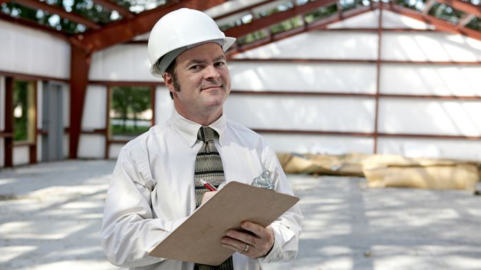 Building inspector with a clipboard