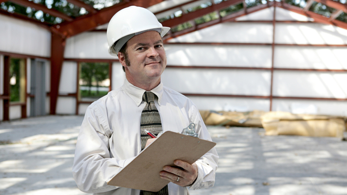 Building inspector with a clipboard
