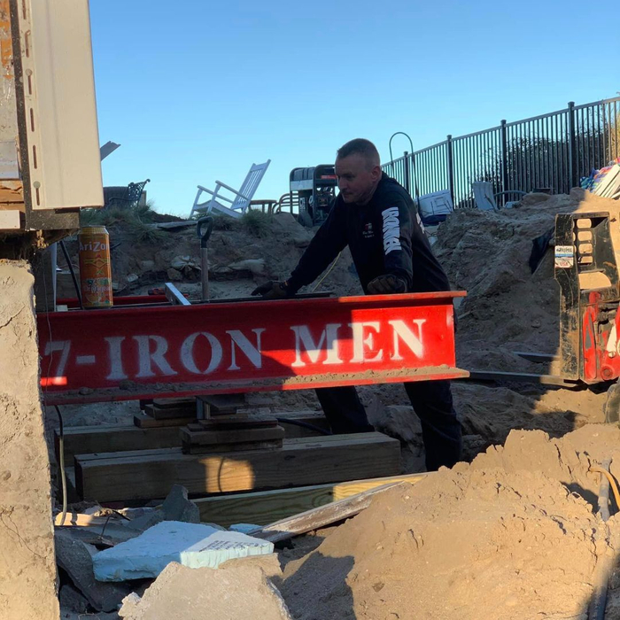 man working at house lifting job site