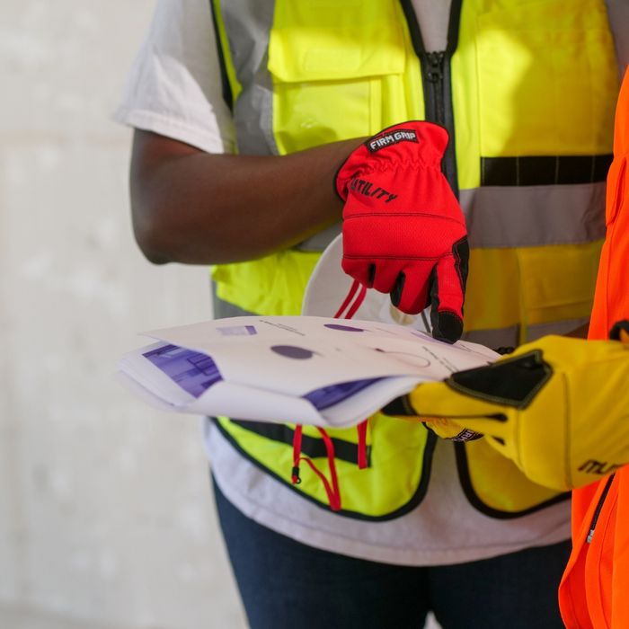 Construction workers looking at documents