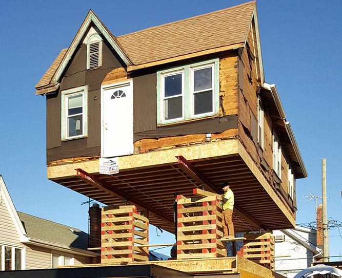 Image of a house being lifted