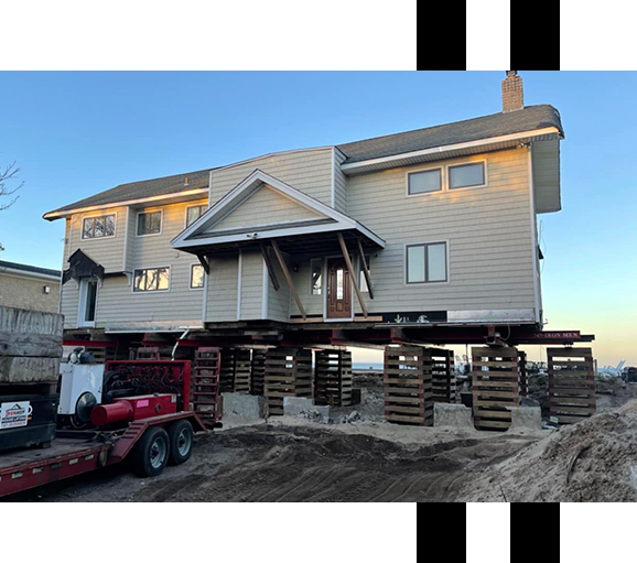 Image of a house being lifted