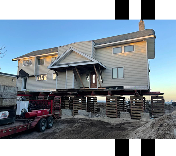 Image of a house being lifted Image of a house being lifted