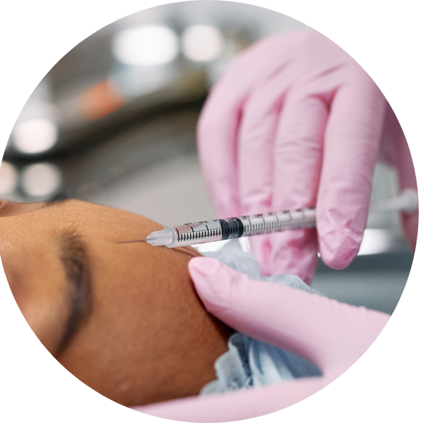 woman receiving an injection in her forehead