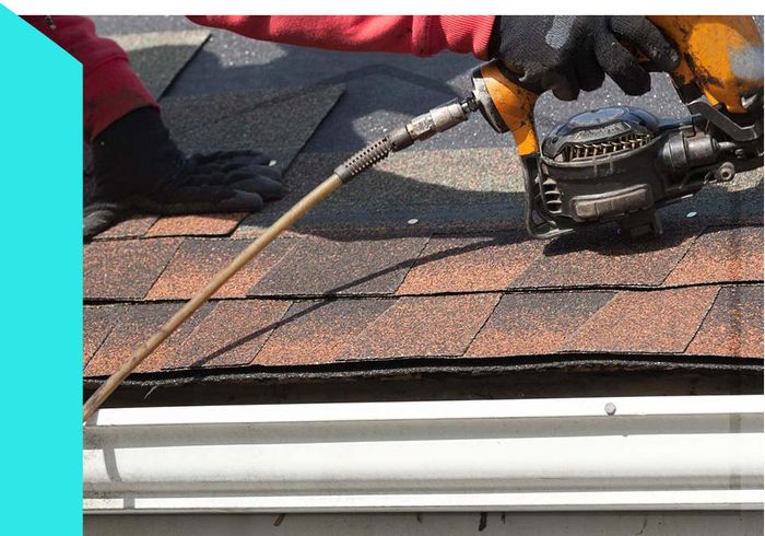 roofer nailing shingles
