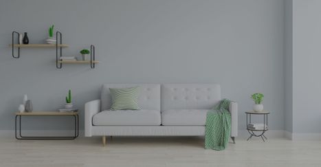 An image of a white sofa in a white room.