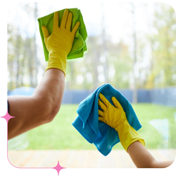 Two cleaners wiping down windows