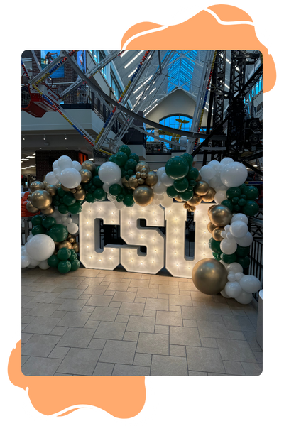 CSU marquee sign with balloon arch at Scheels