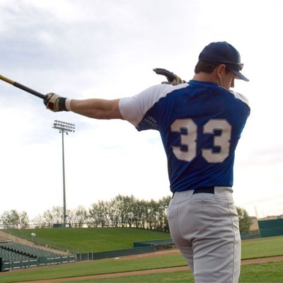 male baseball player with bat