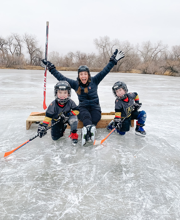 Meghan and the boys playing pond hockey 