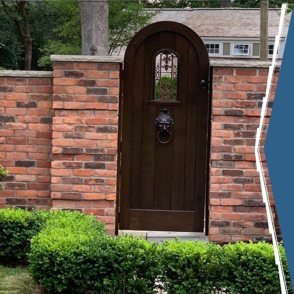 Brick gate with a wooden door