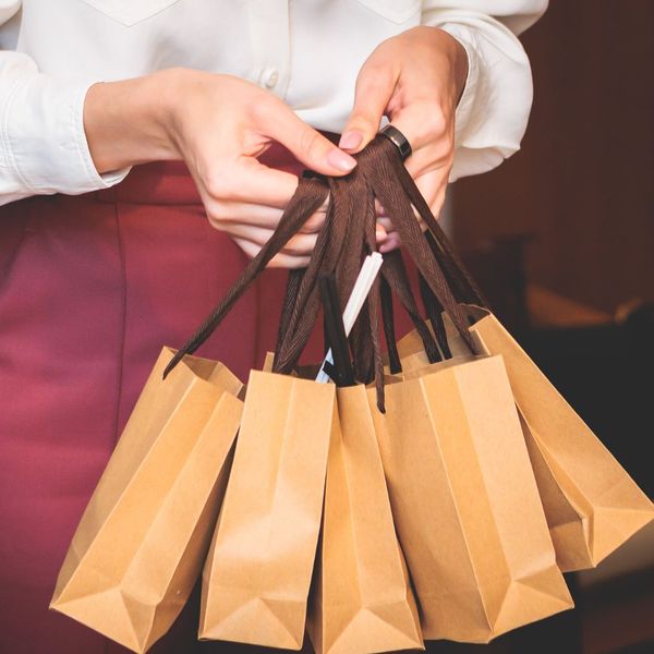 holding little shopping bags