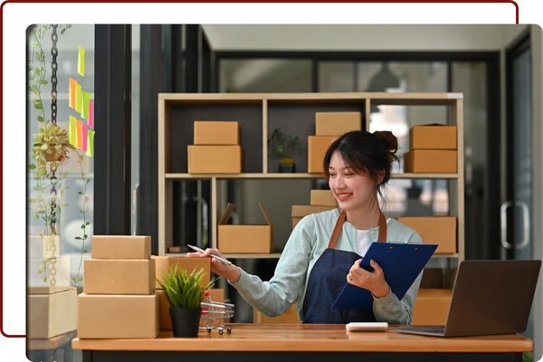 a woman packing boxes Business Lines of Credit.jpg