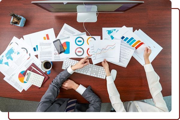 business owners looking over data About.jpg
