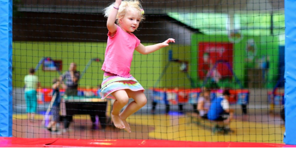 image of little girl jumping on a trampoline.png